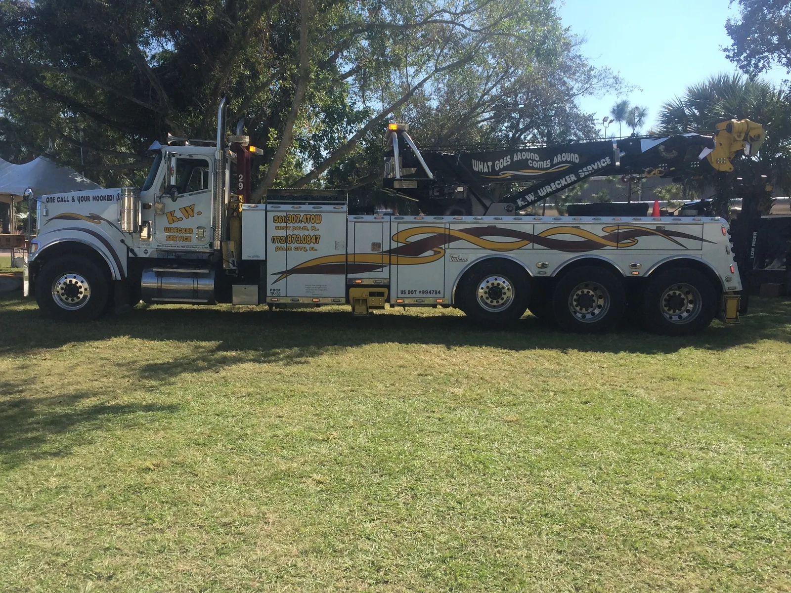 KW Wrecker Service heavy-duty rotator wrecker with custom paint on display